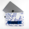 Housse bilum ouverte avec un MacBook à l'intérieur, protection rembourrée